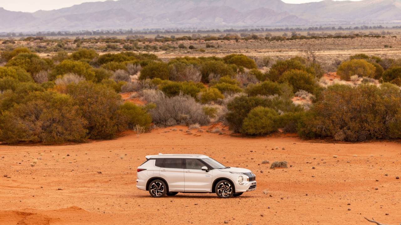 Mitsubishi Outlander PHEV parked in outback Australia.